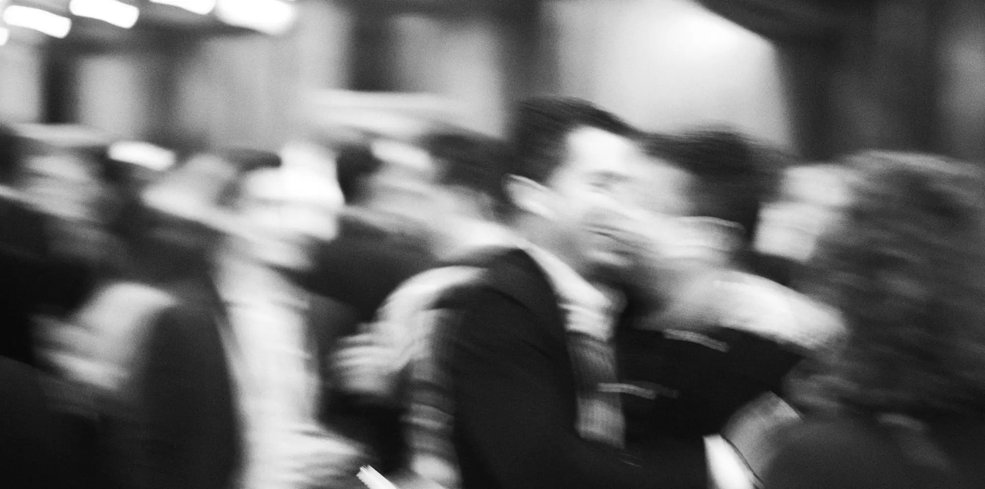 Guests in conversation at AssetRush, black and white